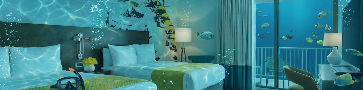 An underwater-themed hotel room with two beds, sea-life wallpaper, a balcony, and aquatic ambiance, glowing bedsides, and starfish accents.