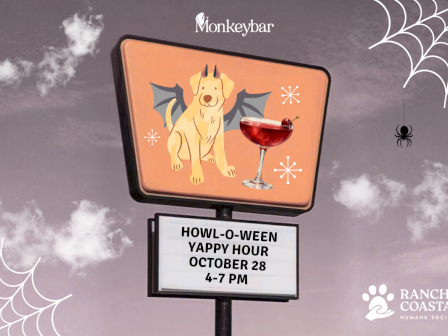 A &ldquo;Monkeybar&rdquo; Halloween promo sign shows a smiling golden dog with a mocktail, advertising Howl-o-ween Yappy Hour Oct 28, 4&ndash;7 PM.