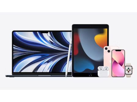 A lineup of electronics: a laptop, a tablet, two smartphones, wireless earbuds, and a smartwatch with a charging case.